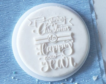 Merry christmas and happy new year inscription in leafs embosser, cookie biscuit stamp, cake decorating, fondant icing.