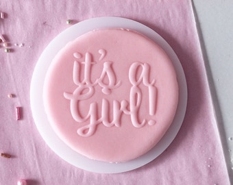 It's a girl embosser, cookie biscuit stamp, cake decorating, fondant icing.