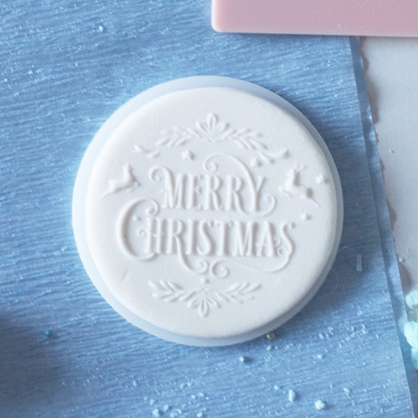 Merry christmas in decorations embosser, cookie biscuit stamp, cake decorating, fondant icing.