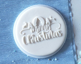 Merry christmas + fawns inscription in leafs embosser, cookie biscuit stamp, cake decorating, fondant icing.