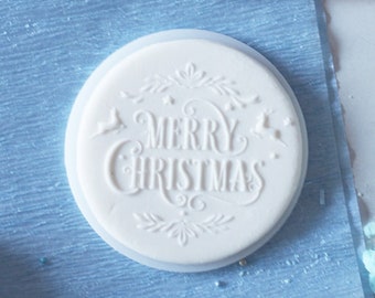 Merry christmas in decorations embosser, cookie biscuit stamp, cake decorating, fondant icing.