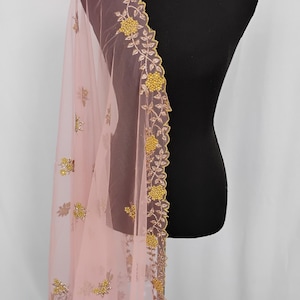 May include: A handmade, wooden cutting board with a natural wood grain. The board features a juice groove and a handle for easy carrying. Dimensions: 18 inches long, 12 inches wide, and 1 inch thick.