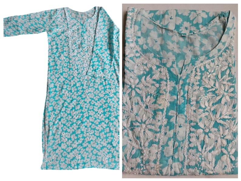 May include: A turquoise tunic with white floral embroidery. The long-sleeved tunic features a round neckline and a buttoned placket. The fabric is patterned with small white flowers and detailed embroidery around the neckline and cuffs.
