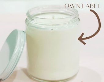 May include: A clear glass jar candle with a white lid. The candle is 8 oz and has a white wax. The text "ADD YOUR OWN LABEL" is on the image with an arrow pointing to the jar. The text "Choose Your Scent" is also on the image.