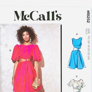 May include: McCall's sewing pattern for a dress with three different views. The dress has a cut-out detail at the waist and a tie at the back. The pattern is for sizes F5 (16-18-20-22-24).
