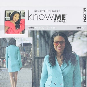 May include: A sewing pattern for a turquoise blazer dress with a double breasted closure. The pattern is for sizes 8-10-12-14-16. The pattern is from the knowME by mimig brand. The pattern is called BEAUTE' J'ADORE. The pattern includes a QR code for a sew-along video tutorial.