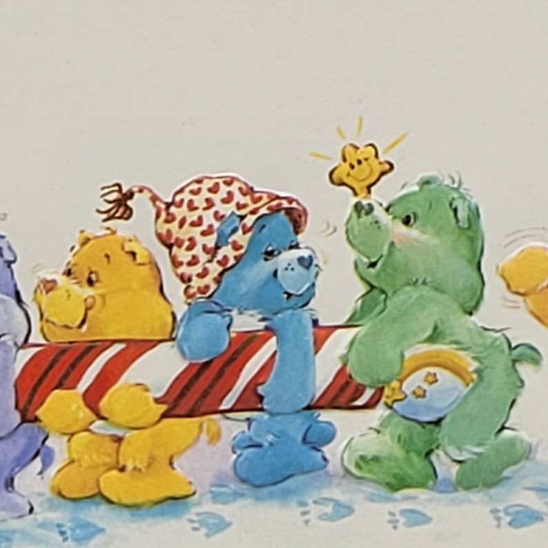 May include: A vibrant illustration of Care Bears. A blue Care Bear, wearing a heart-patterned hat, leans on a red and white striped bar. A green Care Bear holds a star. Other bears are visible in the background.