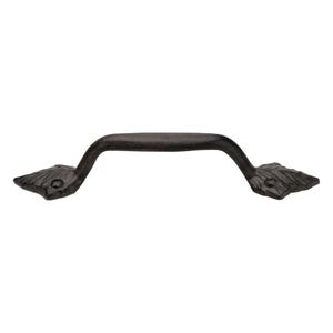 May include: A dark brown, cast iron cabinet pull with a curved handle. The ends of the pull are shaped like leaves, adding a decorative touch. This hardware is suitable for drawers and cabinets.