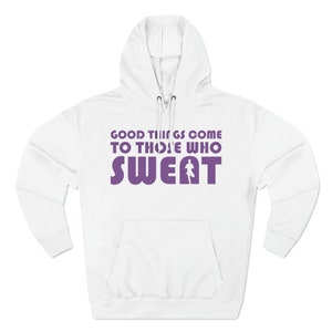 May include: White hooded sweatshirt with a purple graphic that says "Good things come to those who sweat" with a running person icon in the word "sweat".