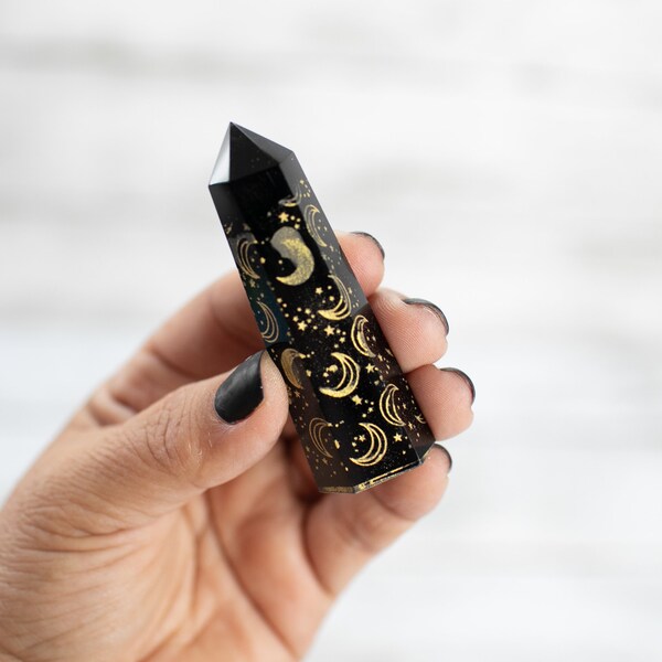 Black Obsidian Tower with Carved Moon and Stars in Gold