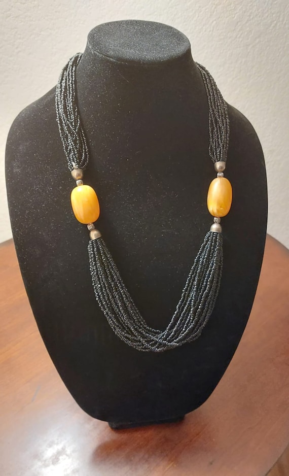 Gorgeous beaded black necklace with 2 large Amber 