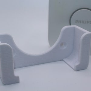 Wall mount for the Philips Hue Bridge module (no drilling required)