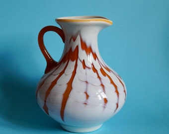 Handblown glass jug with an orange/white pattern