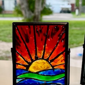 4 3/4 inch tall Beautiful hand painted sun fire stained glass effect in a black metal frame picture free shipping