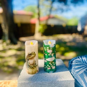 May include: A set of three ceramic mugs with a speckled, matte finish. The mugs are in shades of cream, light gray, and dark gray. Each mug has a simple, minimalist design and a rounded handle.