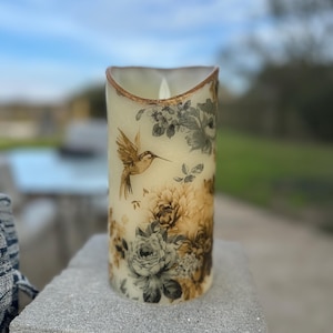 8 inch tall 4 inch wide Hummingbird and floral flameless candle with realistic wick batteries included free shipping