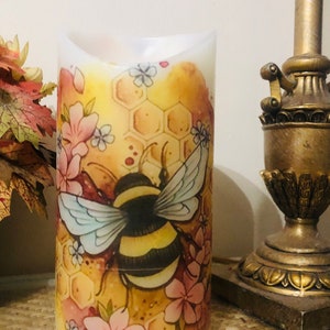 8 inch tall Bee hive and floral pillar candle with Oatmeal milk and honey fragrance fast free shipping