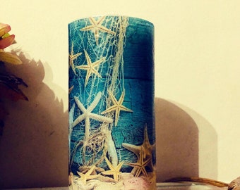 Six inch tall starfish and seashells pillar candle with sugar sand beach fragrance oil