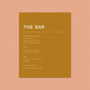 May include: A brown card with the text "THE BAR" in white. The card lists a signature cocktail, "Mine-To-Be Mojito", with ingredients, as well as beer, wine, and non-alcoholic options.