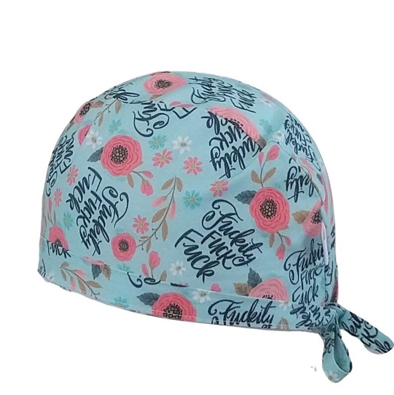 May include: A light blue scrub hat with a floral pattern and the text "F*ckity F*ck F*ck" repeated throughout.