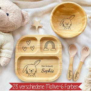 Könnte beinhalten: Eine Baby-Schüssel aus Holz mit einem Hasen-Design und dem eingravierten Namen "Sophie". Die Schüssel ist Teil eines Sets, das einen Holzteller mit einem Regenbogen- und Herz-Design sowie zwei Holzlöffel mit dem eingravierten Namen "Sophie" enthält.
