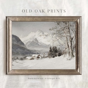 Könnte beinhalten: Ein Vintage-Aquarellbild einer schneebedeckten Berglandschaft mit einem kleinen Dorf im Vordergrund. Das Bild ist in einem silbernen Rahmen gerahmt und trägt den Text "Old Oak Prints" und "Remastered Vintage Art", der unter dem Bild gedruckt ist.