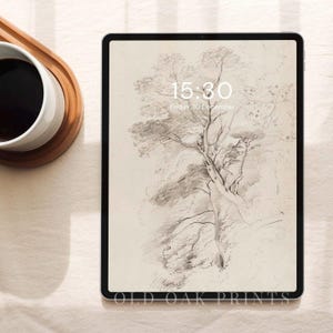 Peut inclure: Une tablette numérique affichant un dessin en noir et blanc d'un arbre avec l'heure 15:30 et la date vendredi 10 décembre à l'écran. La tablette est sur une surface beige.