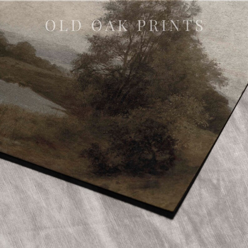 May include: A vintage-style print of a landscape scene with a river winding through a forest. The print is in shades of brown and gray, with a soft, muted color palette. The text "OLD OAK PRINTS" is visible in the upper right corner of the print.