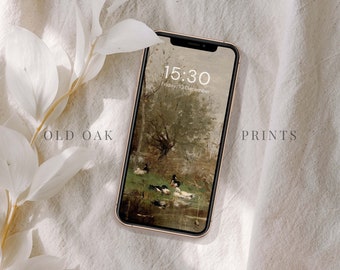 May include: A gold iPhone with a black screen displaying the time 15:30 and the date Friday 10 December. The background image on the screen is a painting of a forest scene with ducks in a pond.