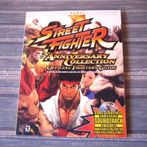 Street Fighter Official Strategy Guide Anniversary Collection By BradyGames, Paperback Magazine With Soundtrack Included Used But Like New