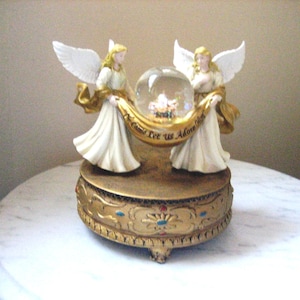Angels Glitter Snow Globe Music Box Designed for Collections Etc., Christmas Angel/Baby Jesus  Musical Figurine &quot;Oh Come Let Us Adore Him&quot;