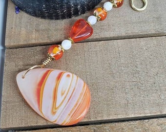 Orange, striped agate polished stone purse charm
