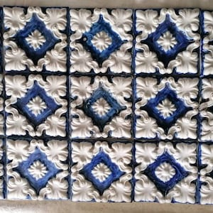 Wonderful set of 15 relief liberty tiles in Cobalt blue.