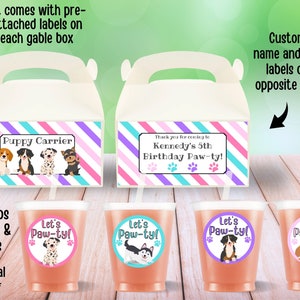 May include: A party favor kit for a dog-themed birthday party. The kit includes gable boxes with pre-attached labels that say "Puppy Carrier" and "Thank you for coming to Kennedy's 5th Birthday Paw-ty!"  The kit also includes 12-ounce cups with lids and straws, and stickers with a dog and the text "Let's Paw-ty!"