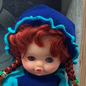 Lightweight large cuddly doll - vinyl head, hands and feet, woolen knitted dresses - Woolworth doll