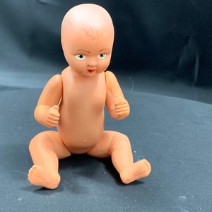 Old doll of 14 cm (5.57 inch) with movable arms and legs in mint condition