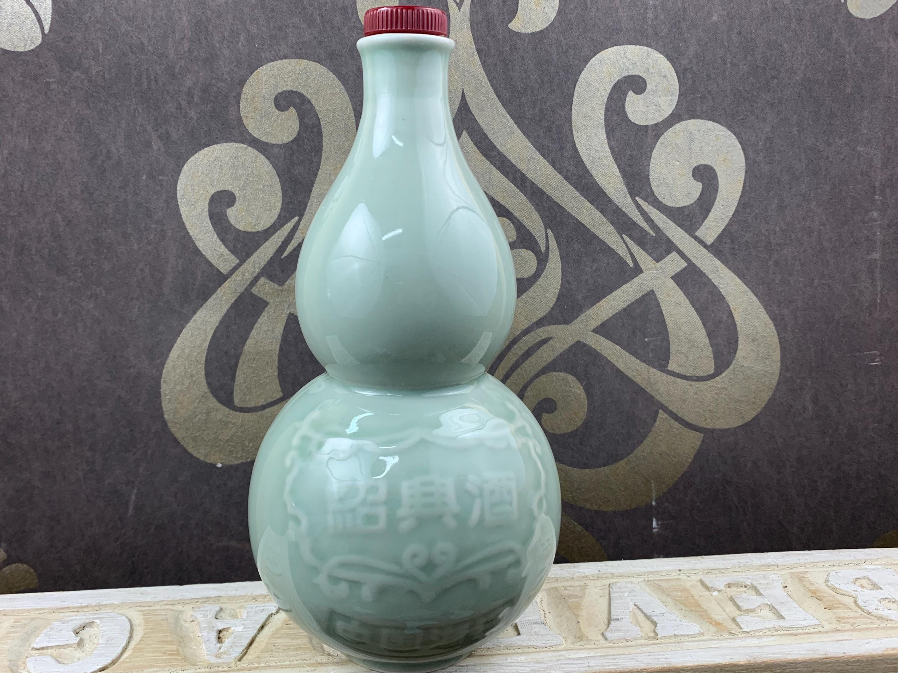 Beautiful light green decorative earthenware old bottle with cork stopper in perfect condition
