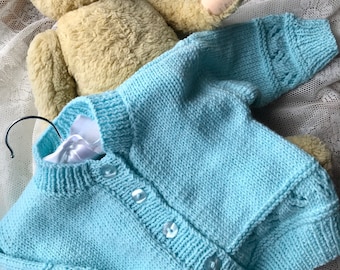 Hand knitted baby girls’ cardigan