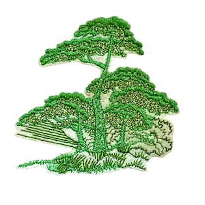May include: Green embroidered patch depicting a stylized landscape with three trees and a grassy area. The trees are outlined in black and filled with green stitching.