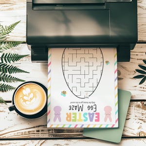 May include: A printable Easter egg maze activity sheet with a colorful rainbow border. The maze features a bunny rabbit and the text "Easter Egg Maze". Help the bunny get to the carrot.