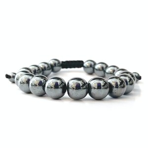 May include: A black hematite beaded bracelet with a black cord.