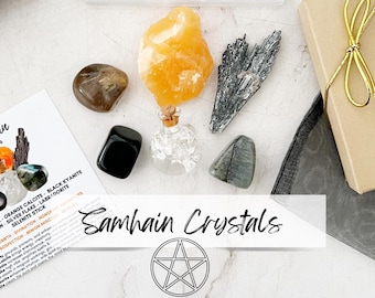 May include: A collection of crystals for Samhain, including orange calcite, black kyanite, labradorite, selenite, and a clear bottle with a cork stopper. The crystals are arranged on a white surface with a pentagram symbol and the text "Samhain Crystals".
