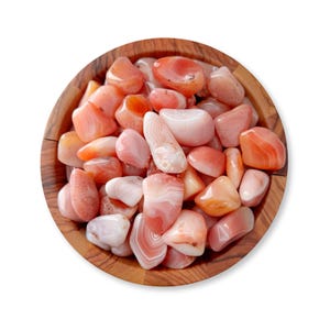 May include: A wooden bowl filled with polished agate stones. The stones vary in shades of orange, pink, and white, with visible banding patterns. The bowl is made of light brown wood.