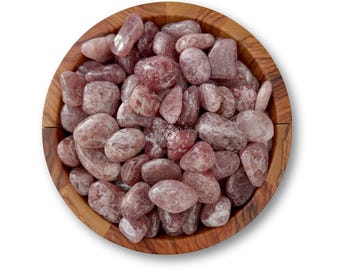 May include: A wooden bowl filled with tumbled strawberry quartz stones. The stones are a mix of pink and translucent hues, with a smooth, polished texture. The bowl is made of light brown wood, and the stones fill the bowl to the top.