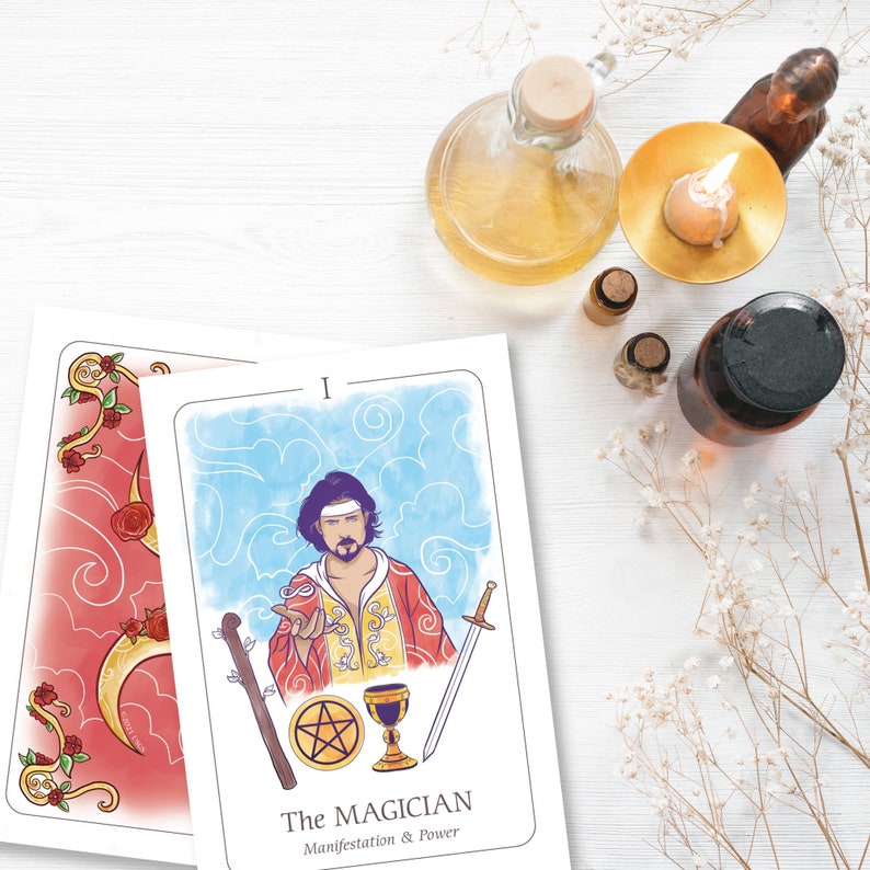 May include: Two tarot cards with illustrations of The Magician, a staff, a pentacle, a chalice, and a sword. The card on the left has a red background with a crescent moon and roses. Other items include a candle, bottles, and dried flowers.