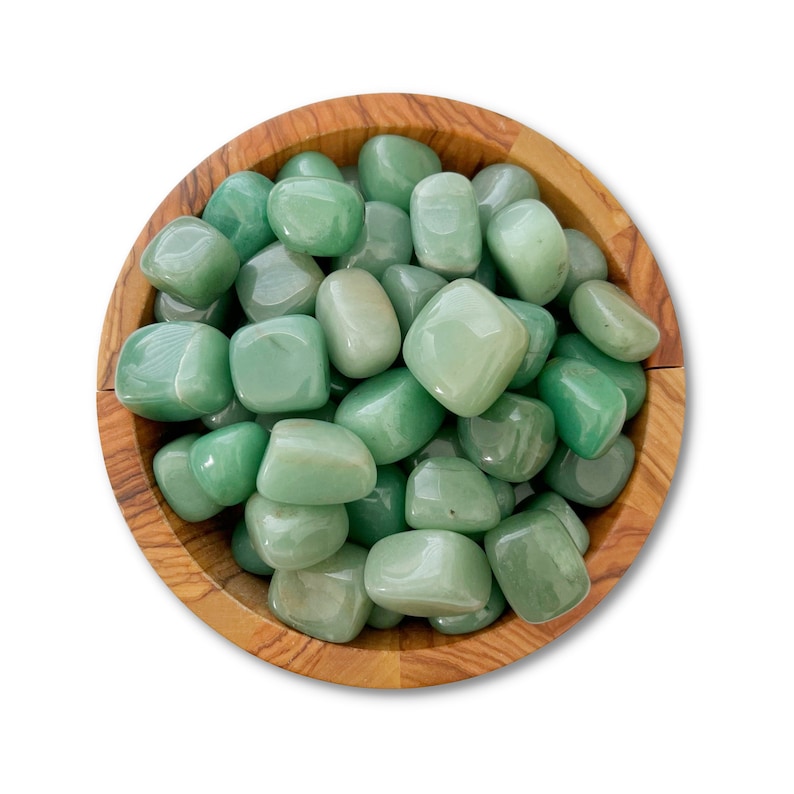 May include: A wooden bowl filled with smooth, green aventurine tumbled stones.