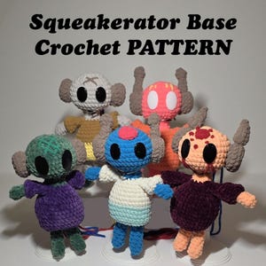 May include: Six crocheted plush toys in various colors, including green, purple, blue, white, orange, and red. The toys have large eyes and are standing on a white surface. The text "Squeakerator Base Crochet PATTERN" is displayed above the toys.