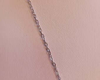 May include: A silver chain necklace with a delicate, linked chain design.