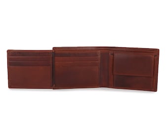 May include: A brown leather wallet with multiple card slots and a billfold. The wallet is open and the interior is visible.