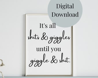 May include: A framed white print with black cursive text that reads "It's all shits & giggles until you giggle & shit." A light blue circle with the words "Digital Download" is in the upper right corner. The print is in a bathroom setting.